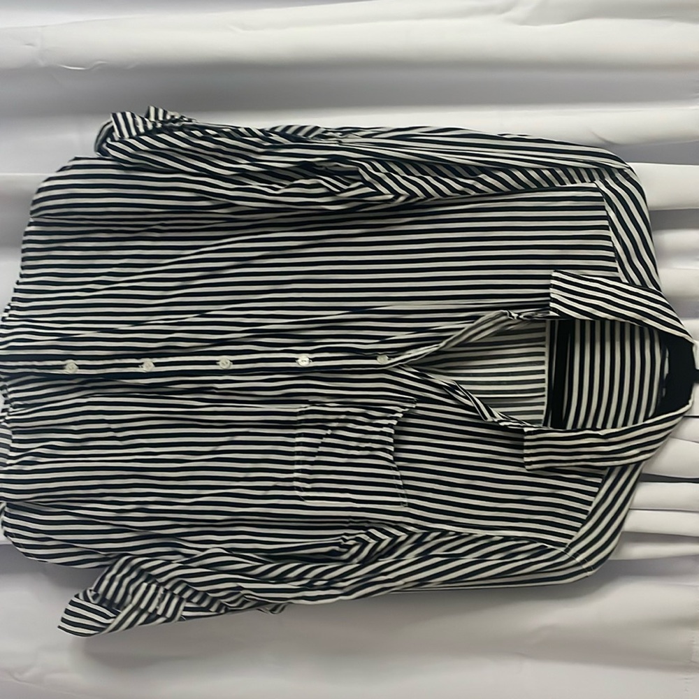 Blue and white stripped button down shirt.